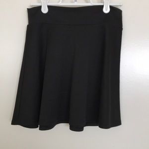 Girls black skater skirt .